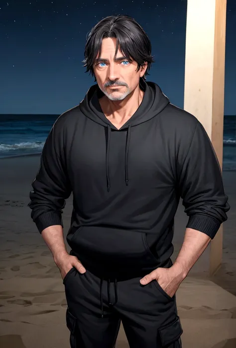 a 55 year old man with dark hair and blue eyes and a black hoodie and black cargo pants at night at the beach
