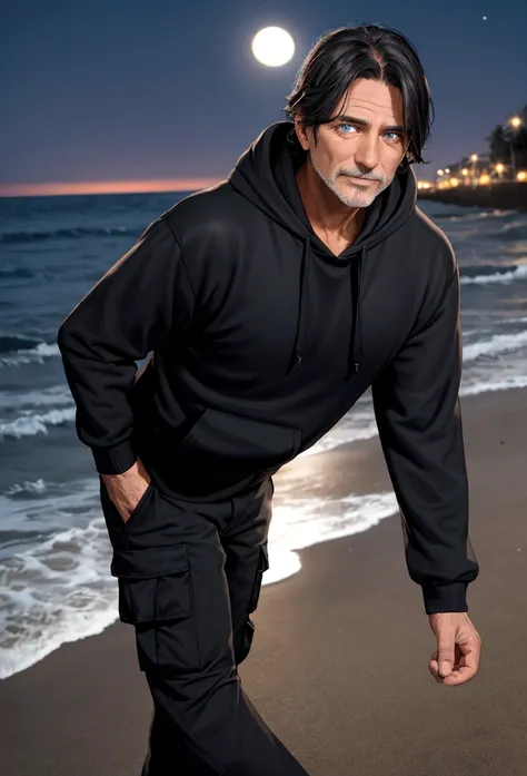 a 55 year old man with dark hair and blue eyes and a black hoodie and black cargo pants at night at the beach
