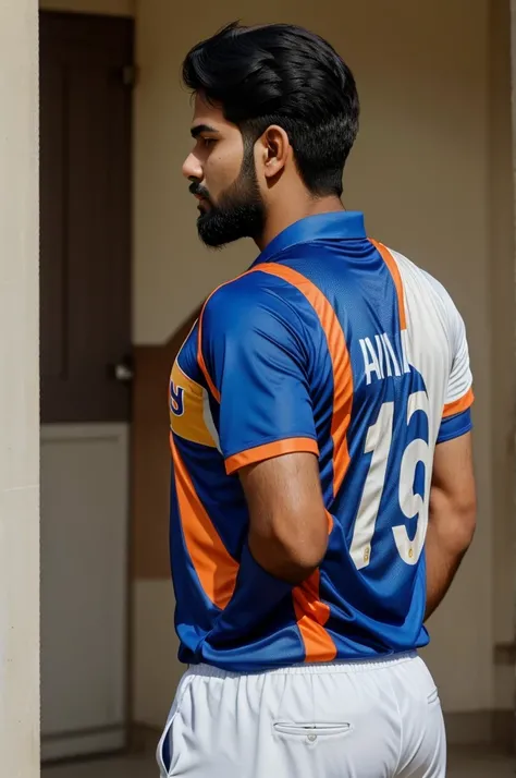 A young man who wears an Indian cricket Jersey with name ARVIND and jersy no. 10 with back side view and light beard and short black hairs
