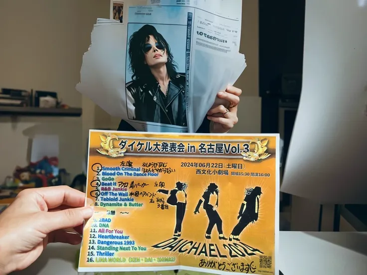 Michael Jackson is holding this paper and showing it to us.