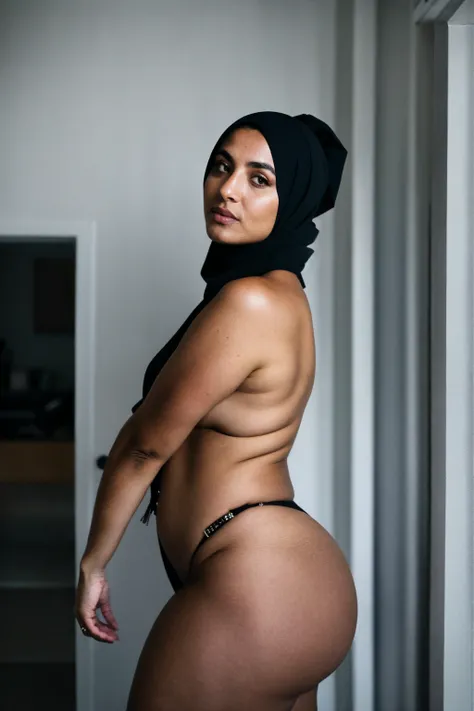 RAW photo,dark,moody,hazy atmosphere,35mm focal lenght,underexposed,cold,candid photograph,artistic,full body,photo of a beautiful,influencer,30yo Kurdish woman,hijab,detailed skin,naked, looking at viewer, thick body structure,grey background,no backgroun...