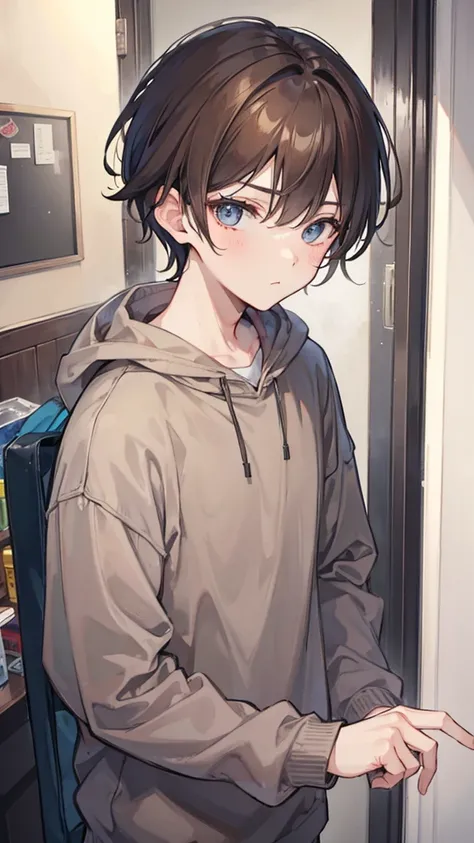 Boy with brown hair wearing gray sweatshirt