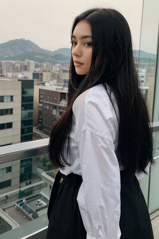 A woman with a sharp face and long black hair was standing and admiring the view.