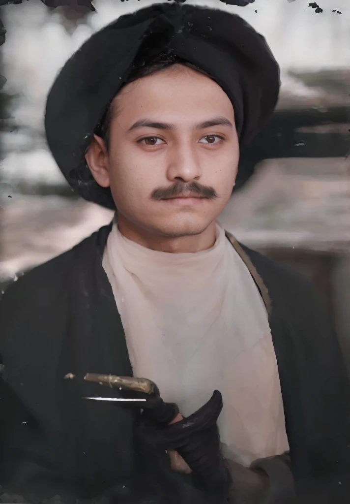 original photo of a young cleric with a very thin mustache, turban and black robe, holding a keris in front