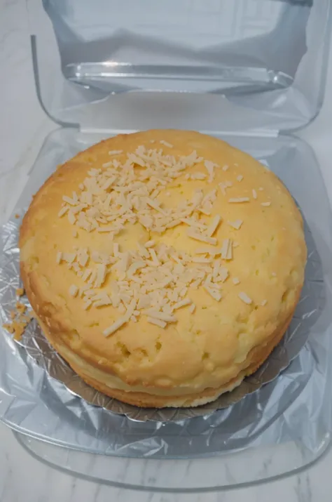 Big donut cake topped with grated cheese