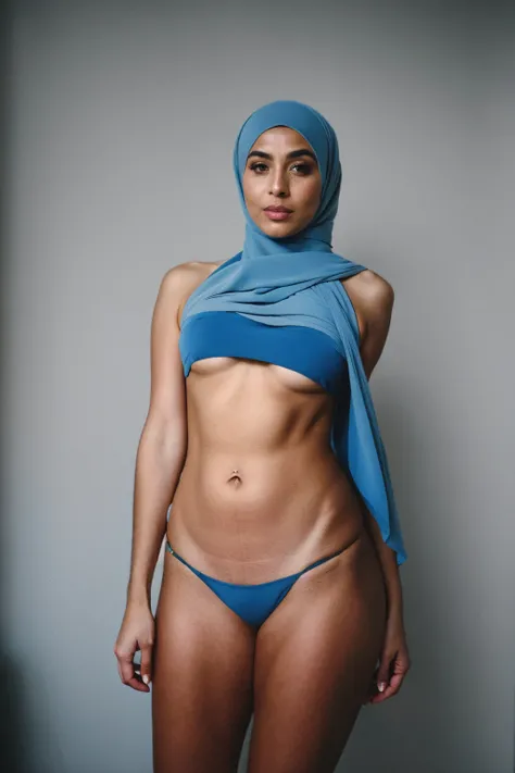 RAW photo,dark,moody,hazy atmosphere,35mm focal lenght,underexposed,cold,candid photograph,artistic,full body,photo of a beautiful,fully naked,influencer,30yo Arab woman,hijab,detailed skin,fully naked,looking at viewer, thick body structure,grey backgroun...