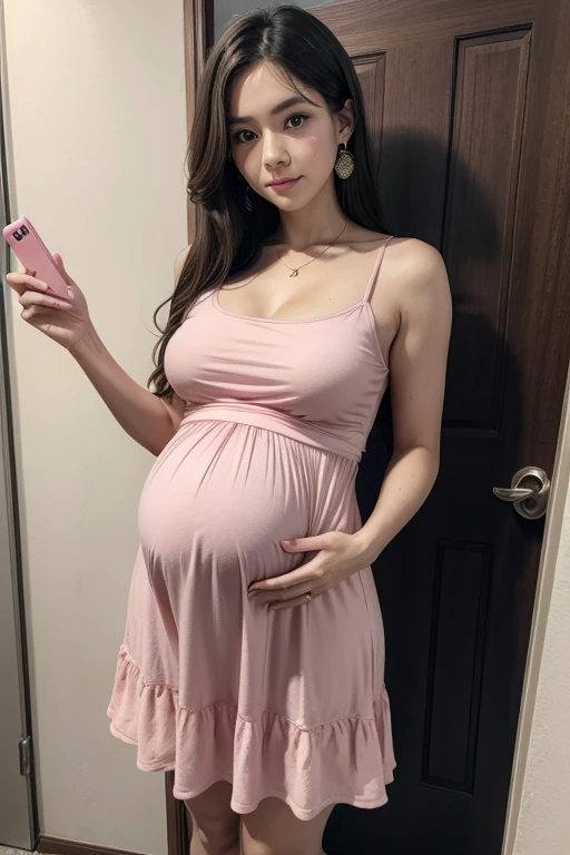 Woman wearing a pink dress and holding a pregnancy test in her hand 