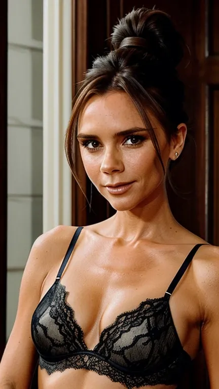 Victoria Beckham with her hair up dressed in liquid colored lace underwear with a smile