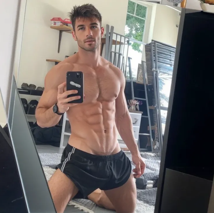 A sexy man taking mirror pics