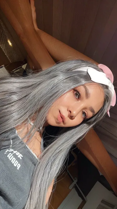 a close up of a woman with long gray hair wearing a headband, with grey skin, straight grey hair, long straight silver hair, her hair is silver, profile image, taken in the early 2020s, long grey hair, grey skin, wearing silver hair, with dark grey hair, l...