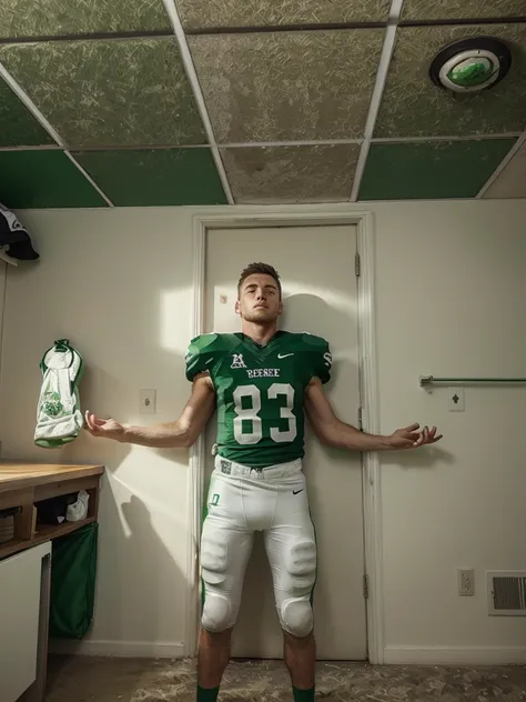 White male Football player wearing green football jersey 