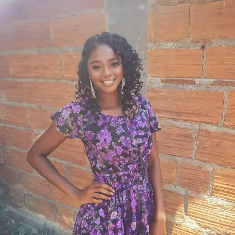 A beautiful dark-skinned girl with curly black hair and in a dress.