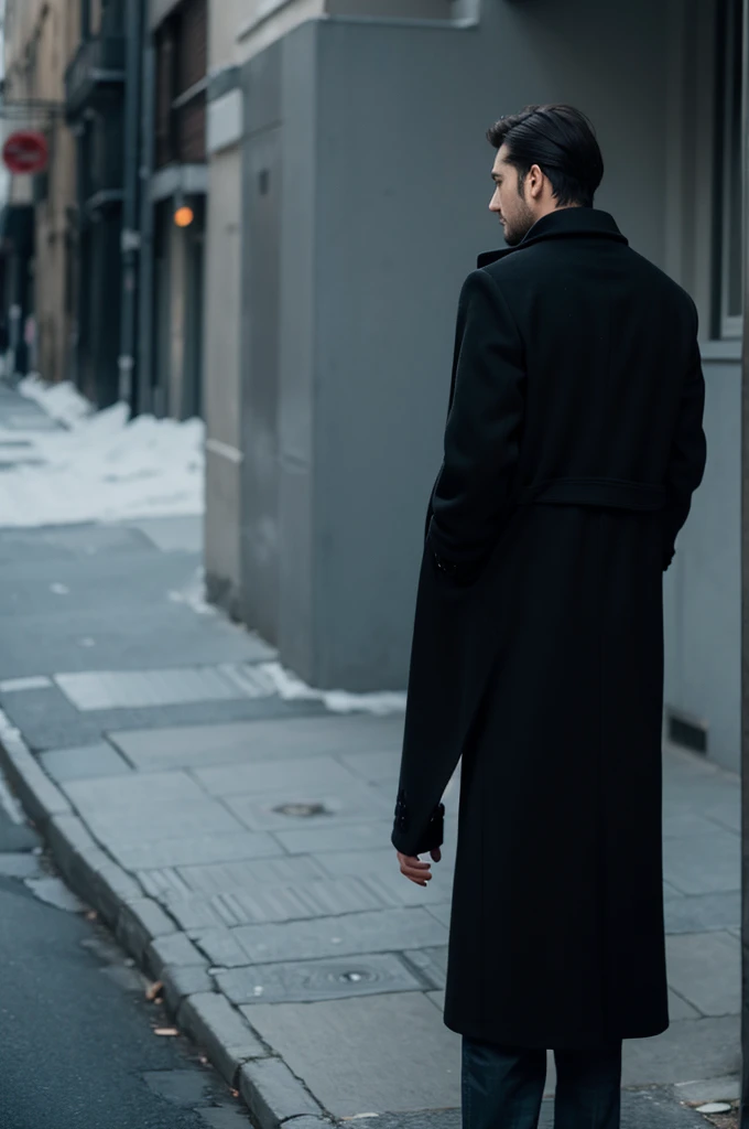 Back view of a man wearing a black coat