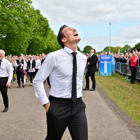 1 man wearing black trousers, white shirt and black tie, looks up at the sky happy because he has reached the finish line.