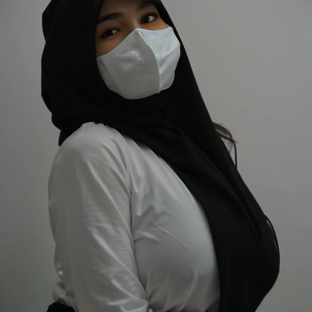 a close up of a woman wearing a mask and a white shirt, white hijab, hijab, wearing mask, wearing facemask, with a covered face, the mask covers her entire face, wearing a mask, no face mask, wearing white silk hood, face covered, covered face, sie boob, t...