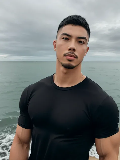 Tony Labrusca, Young man in a tight black t-shirt Standing by the sea with an expression, looking into the distance Turn your head slightly.，Cloudy day, 