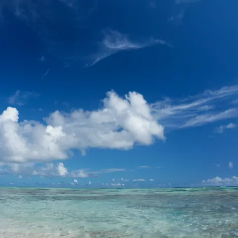 There is a man standing on the beach with a surfboard., sky and Ocean Background, Tropical sea, 澄んだBlue Water, photos of the ocean, Calm sea and beach background, Sea and Sky, Crystal clear sea, blue sea, calm ocean landscape, crystal 澄んだBlue Water, Ocean ...