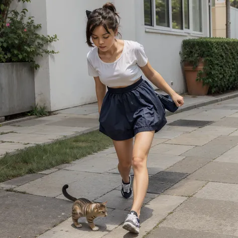 A kitten ran with a small plastic bag