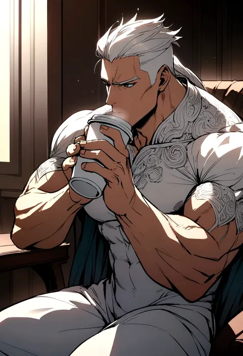 Muscular man sitting and drinking coffee