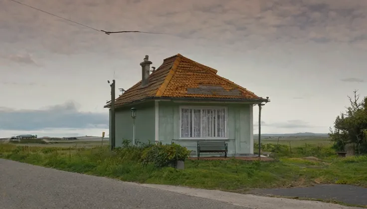 small isolated house, end of paved street, quiet day, no people in the area