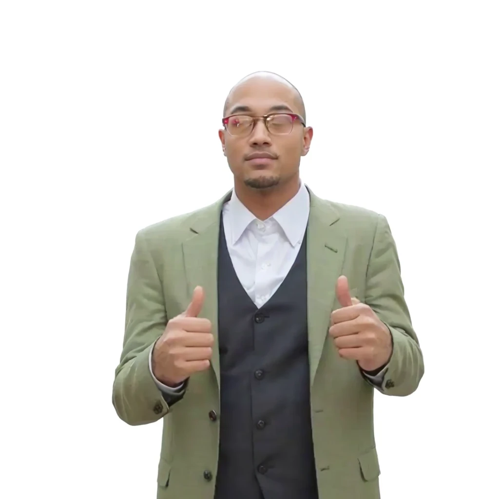 man in green suit and tie giving a thumbs up