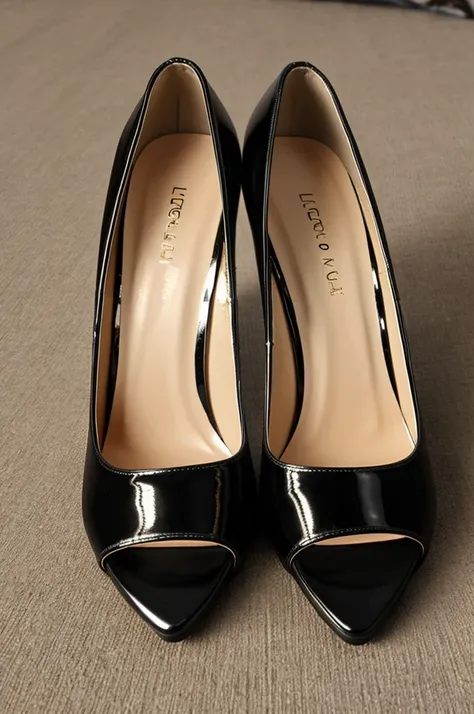 pair of black stiletto heels with a shiny finish and at least 3 inches high.

