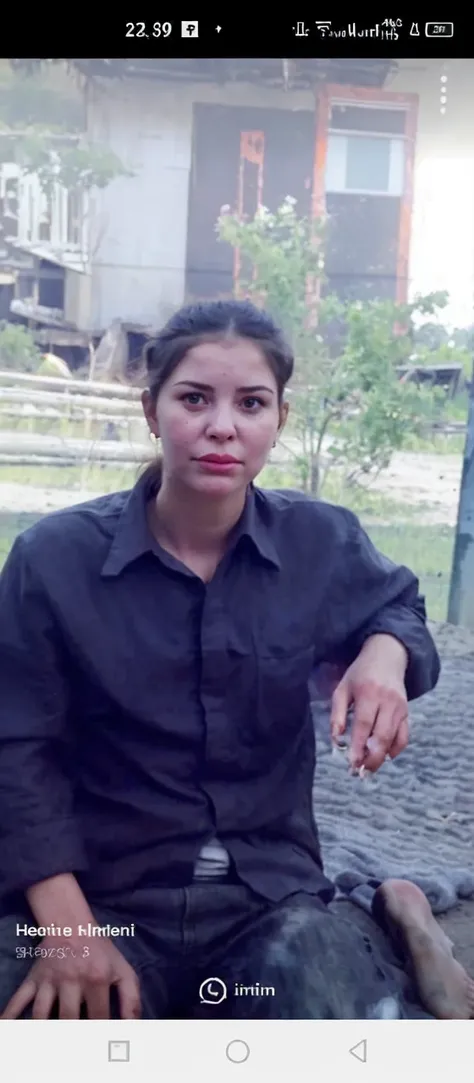 a pregnant woman sits on the ground. scared expression. in front of him a toy in the shape of a human head complete with internal organs with a fire effect .wilderness background