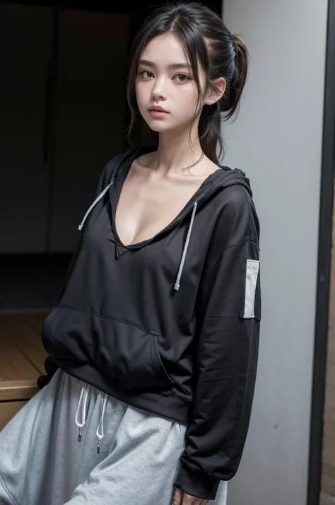 A black hoodie with a small front on the left side at the height of the Lx breasts and on the back a gray white and light blue striped design 