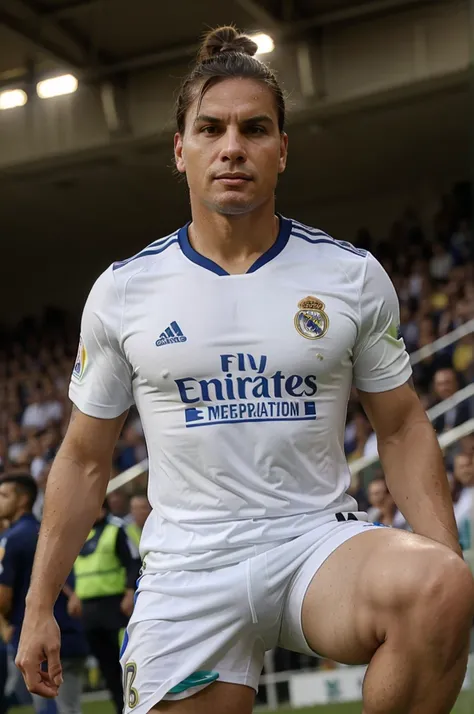 Jair Bolsonaro with a soccer player topknot wearing a Real Madrid shirt in a packed stadium