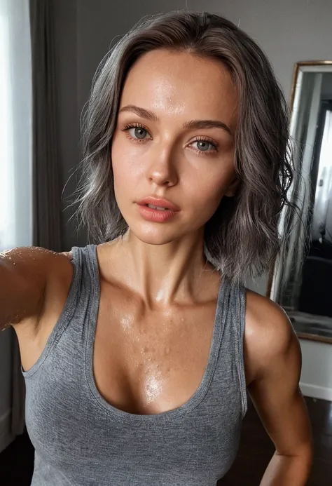 sasha zotova taking selfie indoors, wearing a sweaty wet gray tank top .