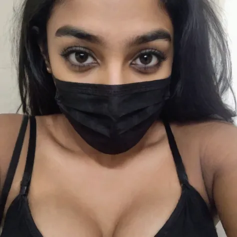 phone photo of a 18 year old south Indian girl in black surgical mask, wearing hot black bra, bending, cleavage chest clearly visible, uploaded on snapchat
