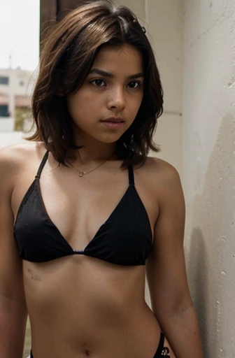 11 year old mexican girl with short, brown hair and wearing a black bikini