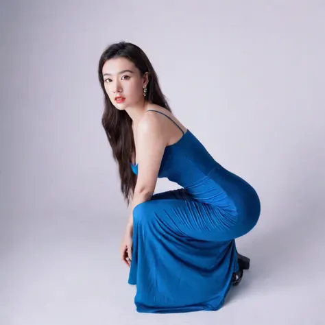 180 degree shot of a young woman squatting on her knees  in a maxi dress, bodycon dress