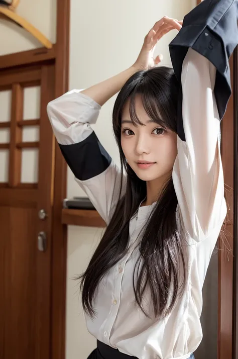 Japanese woman with dark hair, wide shirt, arms raised, armpits visible through sleeves