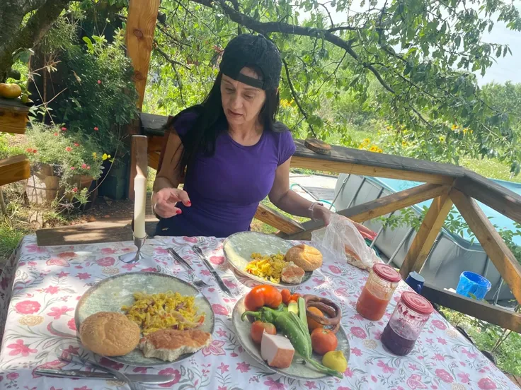 a bear sitting at the table and eating 