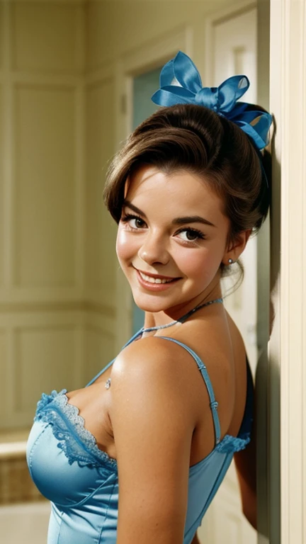 Natalie Wood with her hair up wearing a sexy blue babydoll and smiling