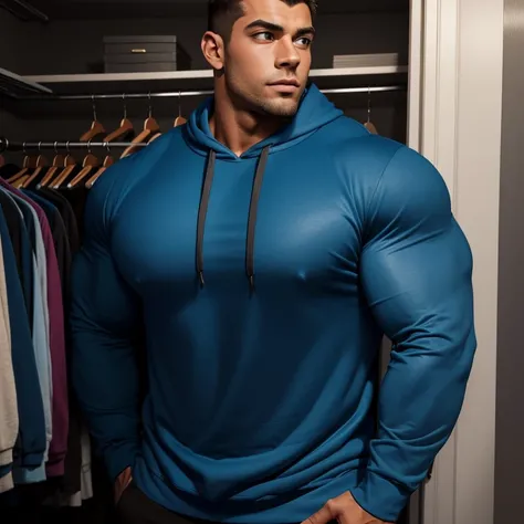 a very handsome young man, massively muscular, with massively large muscles, with massively large biceps, with massively large arms, wearing a blue sweatshirt with long sleeves, in a very cramped closet, he is so large and muscular that he almost does not ...