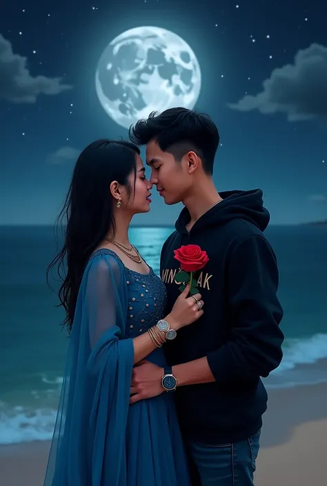 18 year old Indonesian couple standing under full moon on beach with wet black hair girl wearing blue lehenga and boy wearing black hoodie and giving name "MINGKAK"  bold font writer clear on their hoodies hugging and looking at each other necklace bracele...