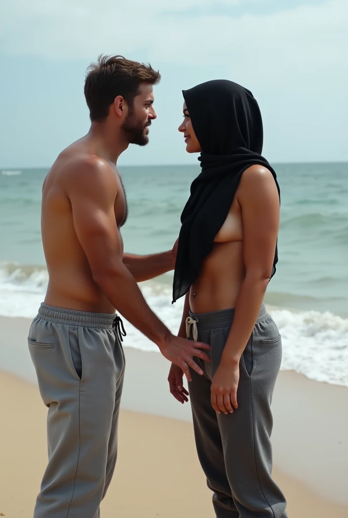 Black headscarf on the beach, grey sweatpants, men touching barefooted women&#39;s breasts