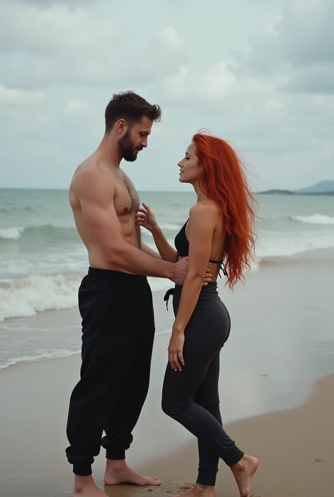 Red haired on the beach, black sweatpants, Men who touch the woman with bare feet. 