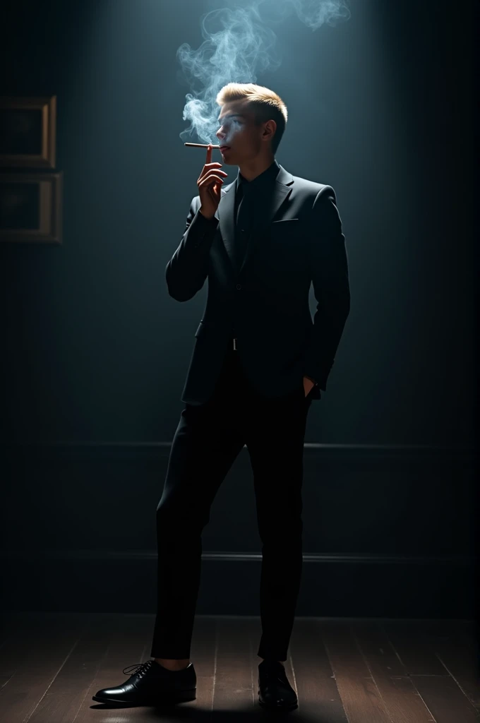 A young blonde white man in a black suit and black shoes smoking a cigarette in a dark room.