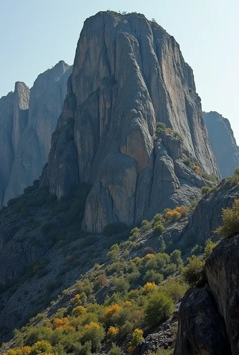 

"Gehlour Mountain is a granite geological formation with a height of 109 meters and a length of 91 meters. Its surface is rough and uneven, with steep slopes and a rounded summit. The mountain has a dark coloration, With shades of gray and brown, and is ...