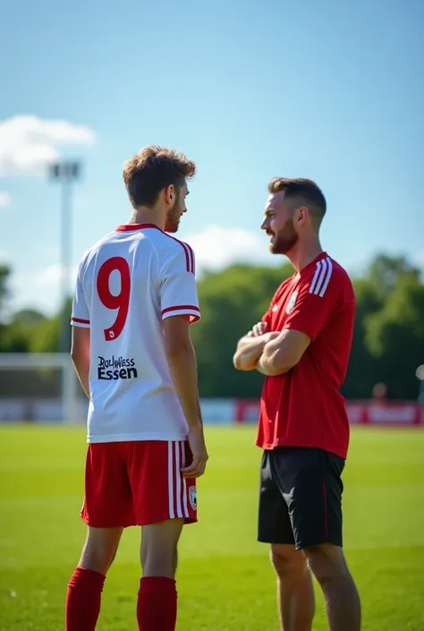 A 17 year old soccer player talking to the coach ,Wears a white and red jersey with the number 9, The jersey says Rot-Weiss Essen, Photographed from behind, 