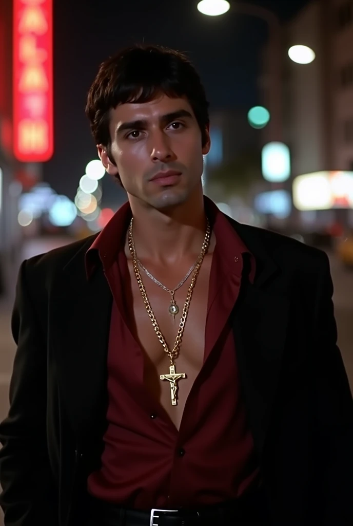 Create Scarface from the movie wearing a burgundy shirt and a black jacket., with a thin gold pendant and a gold cross with Jesus on the thin cross, and also a Cuban chain 