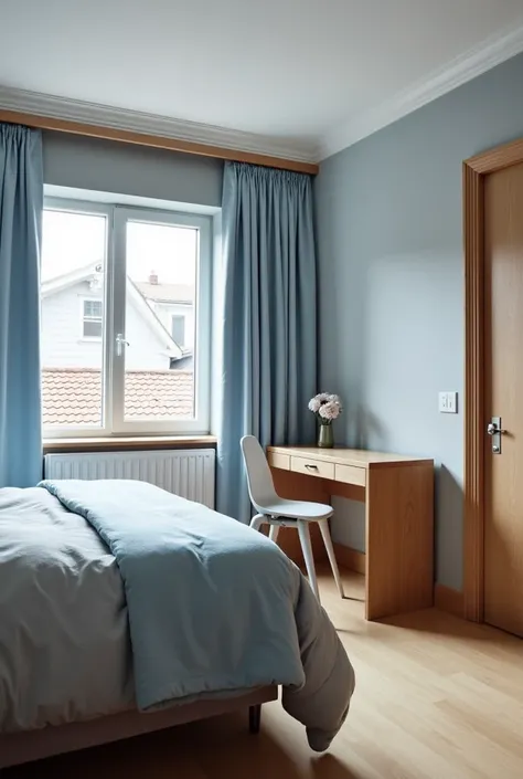 A light blue bed with a grey comforter and light blue curtains. The floor is light brown. A desk is placed next to the bed. The desk is light brown. A chair is placed next to the bed. The chair is grey. The walls are grey. A door is placed next to the bed....