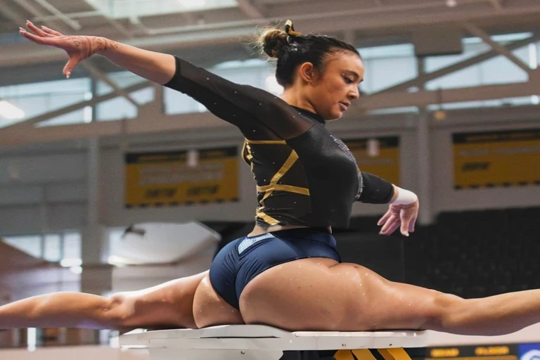 arafed female gymnast doing a split on the beam, wearing leotard, portrait of maci holloway, absolutely outstanding, leotard, sydney hanson, kailee mandel, emily rajtkowski, gemma chen, dominant pose, portrait sophie mudd, noelle stevenson, photo from a sp...