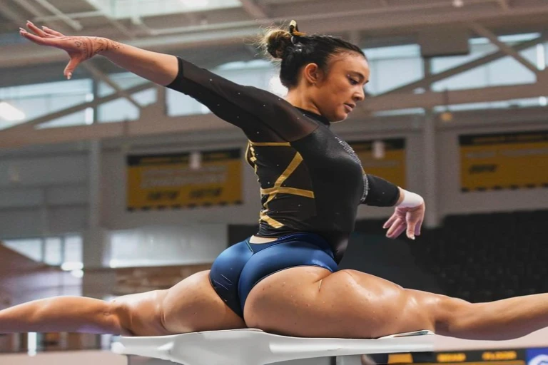 arafed female gymnast doing a split on the beam, wearing leotard, portrait of maci holloway, absolutely outstanding, leotard, sydney hanson, kailee mandel, emily rajtkowski, gemma chen, dominant pose, portrait sophie mudd, noelle stevenson, photo from a sp...