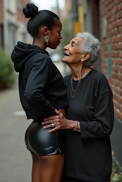 black woman hair in a bun black hoodie   black leather short shorts   a old grandma in a dress on her knees kissing her ass behind her squeezing her butt