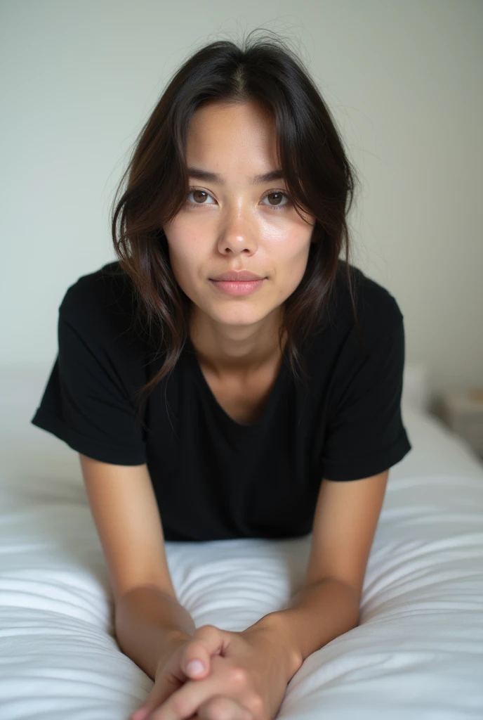 brunette, smile, flat chest, skinny face, white wall, no decoration, jean shorts, black t-shirt, lying on stomach on bed, looking at camera, photo from behind
