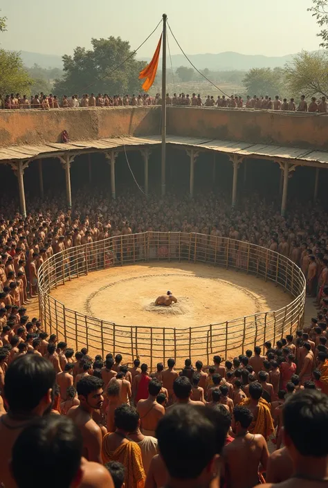 Old empty wrestling ring with people surrounded by it in India
